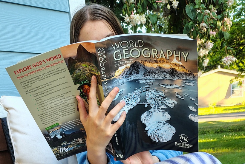 Teen student using Master Books World Geography and Cultures curriculum